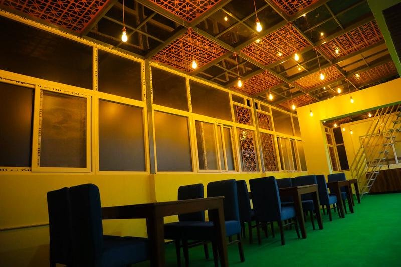 The banquet hall laid with long tables